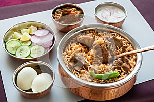 Mutton biryani with traditional sides