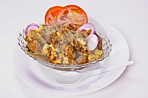mutton cauliflower curry. gobhi gosht served isolated on white background. photo