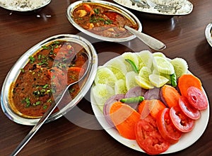 Mutton curry with salad, traditional bengali lunch items