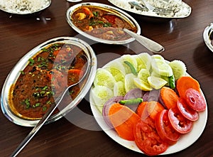 Mutton curry with salad, traditional bengali lunch items