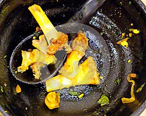 Mutton pieces in a paya soup