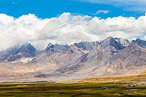 Muztagh Ata seen from Tagharma viewing deck along Karakorum highway, Xinjiang, China.