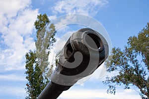 Muzzle of an old tank close-up. Military equipment outdoors