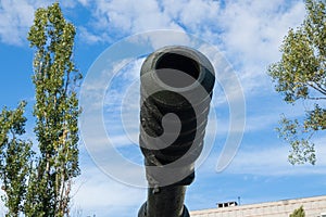 Muzzle of an old tank close-up. Military equipment outdoors