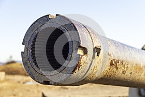 The muzzle of a old Soviet B-13 gun