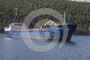 Mv Falknes arrivals Bakke harbor to load gravel