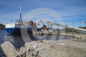 Mv Falknes load gravel at Bakke harbor