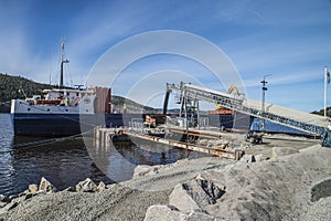 Mv Falknes load gravel at Bakke harbor