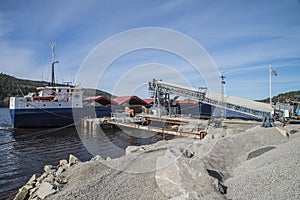 Mv Falknes load gravel at Bakke harbor