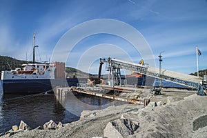 Mv Falknes load gravel at Bakke harbor