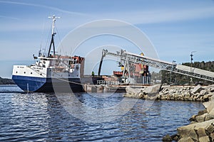 Mv Falknes load gravel at Bakke harbor