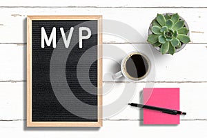 MVP written on letter board next to sticky note, coffee and a succulent plant