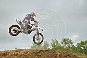 MX racer lands on the front wheel