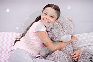 My best friend. Favorite toy. Pure love concept. Girl child hug teddy bear in her bedroom. Pleasant time in cozy bedroom