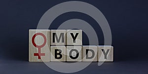 My body and female symbol. Wooden cubes with words `my body` on beautiful grey background. Motivation and human rights concept,