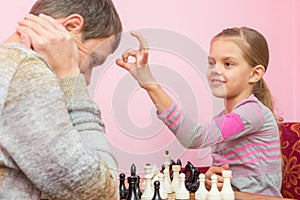 My daughter has a finger on the pope head, who lost a game of chess