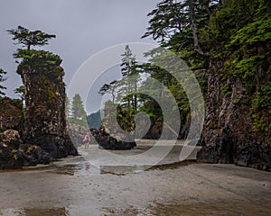 My daughter running around the Sea Sacks at San Josef Bay, Vancouver Island, British Columbia, Canada