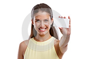 These are my details. Studio shot of a beautiful young woman holding a blank business card against a white background.