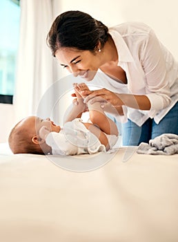 My favourite reason to smile. a happy mother bonding with her baby boy at home.