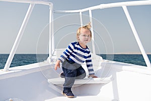 My first travel. Baby boy enjoy vacation on cruise ship. Child cute sailor yacht sunny day. Adventure of boy sailor