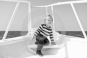 My first travel. Baby boy enjoy vacation on cruise ship. Child cute sailor yacht sunny day. Adventure of boy sailor