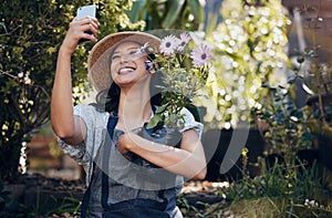 My garden of flowers is also my garden of thoughts. a young female florist working at a nursery.