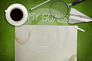 My goals concept on green blackboard with coffee