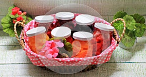 My grandmother`s jam from different berries stylization in glass jars