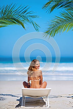 My heart belongs to the beach. Shot of an attractive young woman enjoying a vacation at the beach.