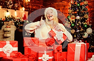 my home. celebrate new year at home. happy woman love presents. Winter shopping sales. cheerful girl red santa hat. xmas