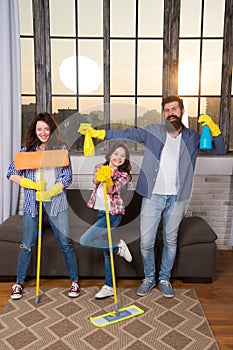 My home cleaned my way. Family clean house. Happy family hold cleaning products. Mother, father and daughter clean house