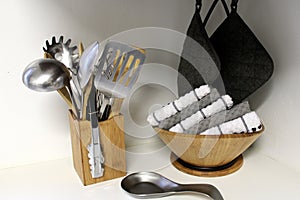 My kitchen utensils, hot pads, and dish towels