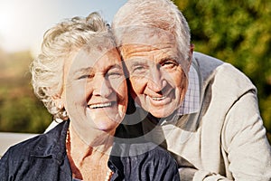 My love, my life. Shot of a happy senior couple relaxing together outdoors.