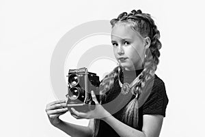 my new camera. cheerful girl with retro look isolated on white. kid vintage fashion. child take photo on retro camera