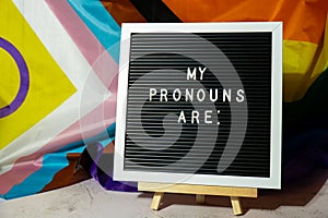 MY PRONOUNS ARE text Neo pronouns concept on Rainbow flag background gender pronouns. Non-binary people rights