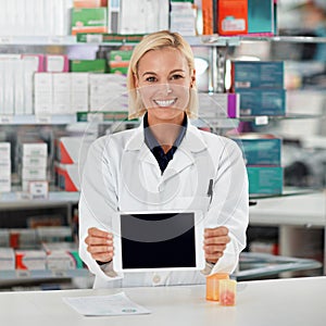 This is my secret weapon when it comes to knowledge. a pharmacist holding up a digital tablet. All products have been