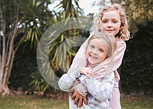 My sister and me, the best of friends well be. two adorable little girls having fun in a garden.