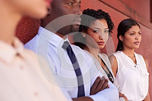 My team and I are unstoppable. Portrait of a young businesswoman standing amongst her colleagues outdoors.