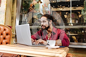 Pleasant nice man typing