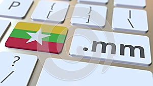 Myanma domain .mm and flag of Myanmar on the buttons on the computer keyboard. National internet related 3D animation