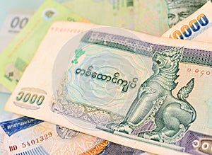 Myanmar Kyat banknote on another Southeast-asian currency bankn