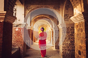 Myanmar lady atanding in the ancient emple