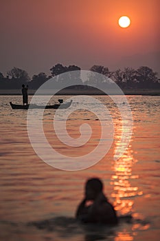 Myanmar - morning bath inside Irrawaddy river