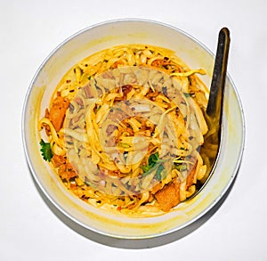 Myanmar traditional or classic white flat noodle salad called Khauk Swe Thoke