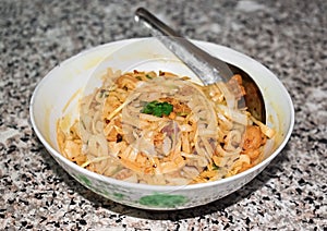 Myanmar traditional or classic white flat noodle salad called Khauk Swe Thoke