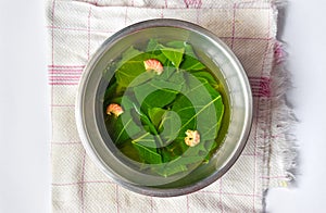Myanmar traditional Dregea volubilis leaf soup recipe. Medicinal home remedy for rheumatic pain, cough, fever and cold