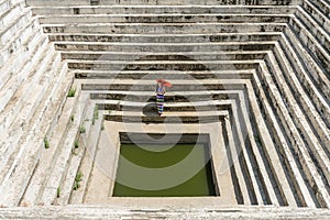 Myanmar woman at ancient pond at Maha Sandar Mahi or Muni Pagoda Amarapura Mandalay