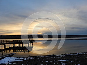 Myer`s Park pier reflections at winter sunset after solstice