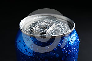 MYKOLAIV, UKRAINE - FEBRUARY 08, 2021: Can of Pepsi with water drops on dark background, closeup