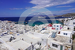 Mykonos cityscape with whitewashed houses and cruise liner in Mediterranean Sea, Greece